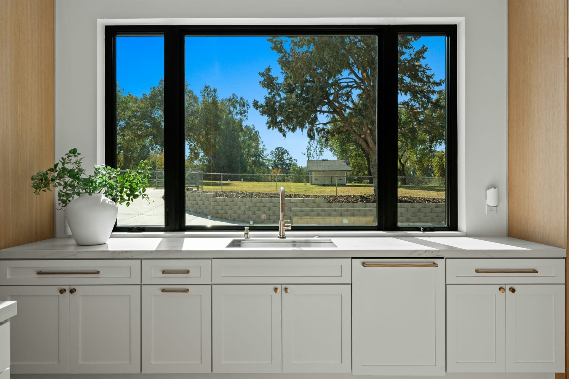 White casement windows installed by NexVue Exteriors Denver