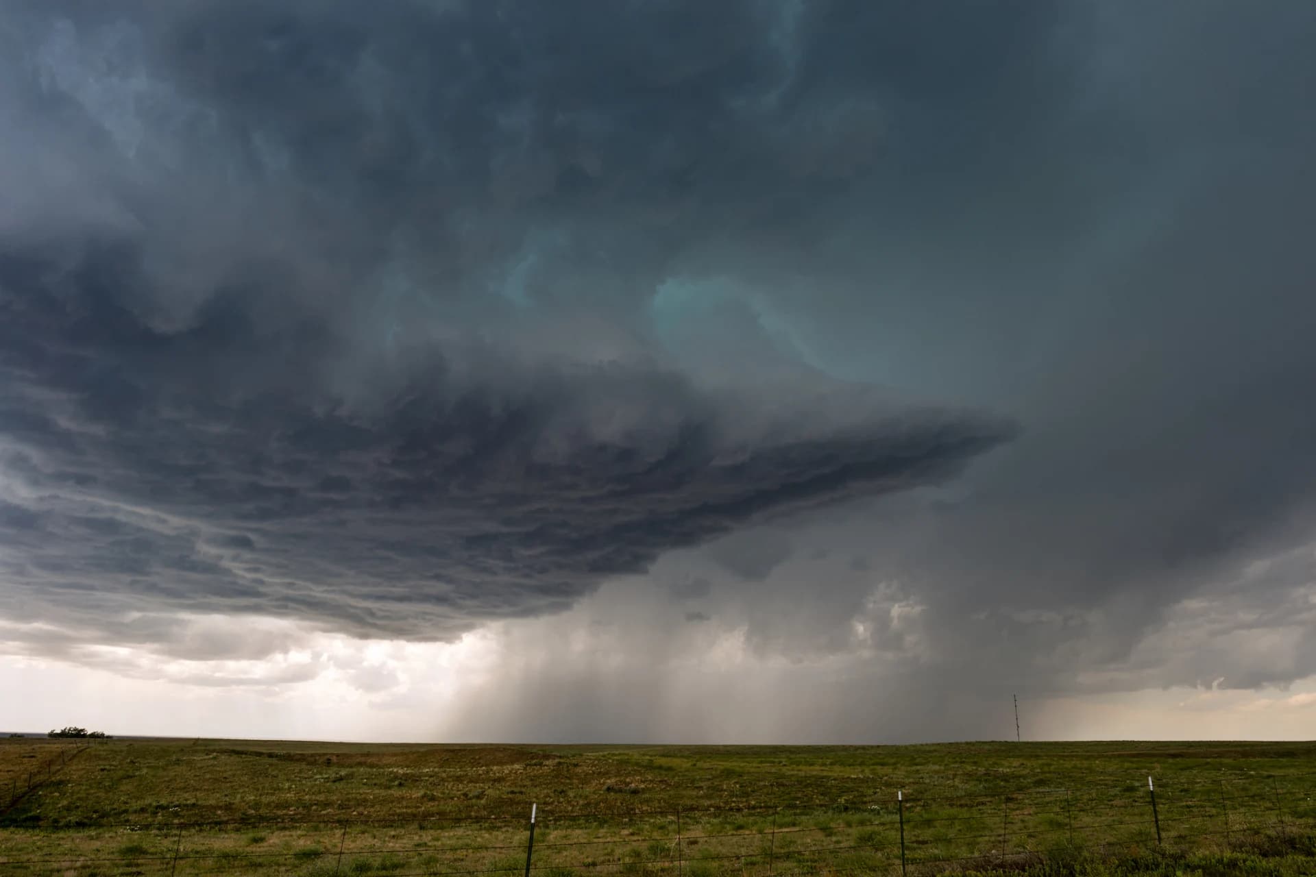 Thunderstorm over Denver home — NexVue Exteriors hail damage replacement