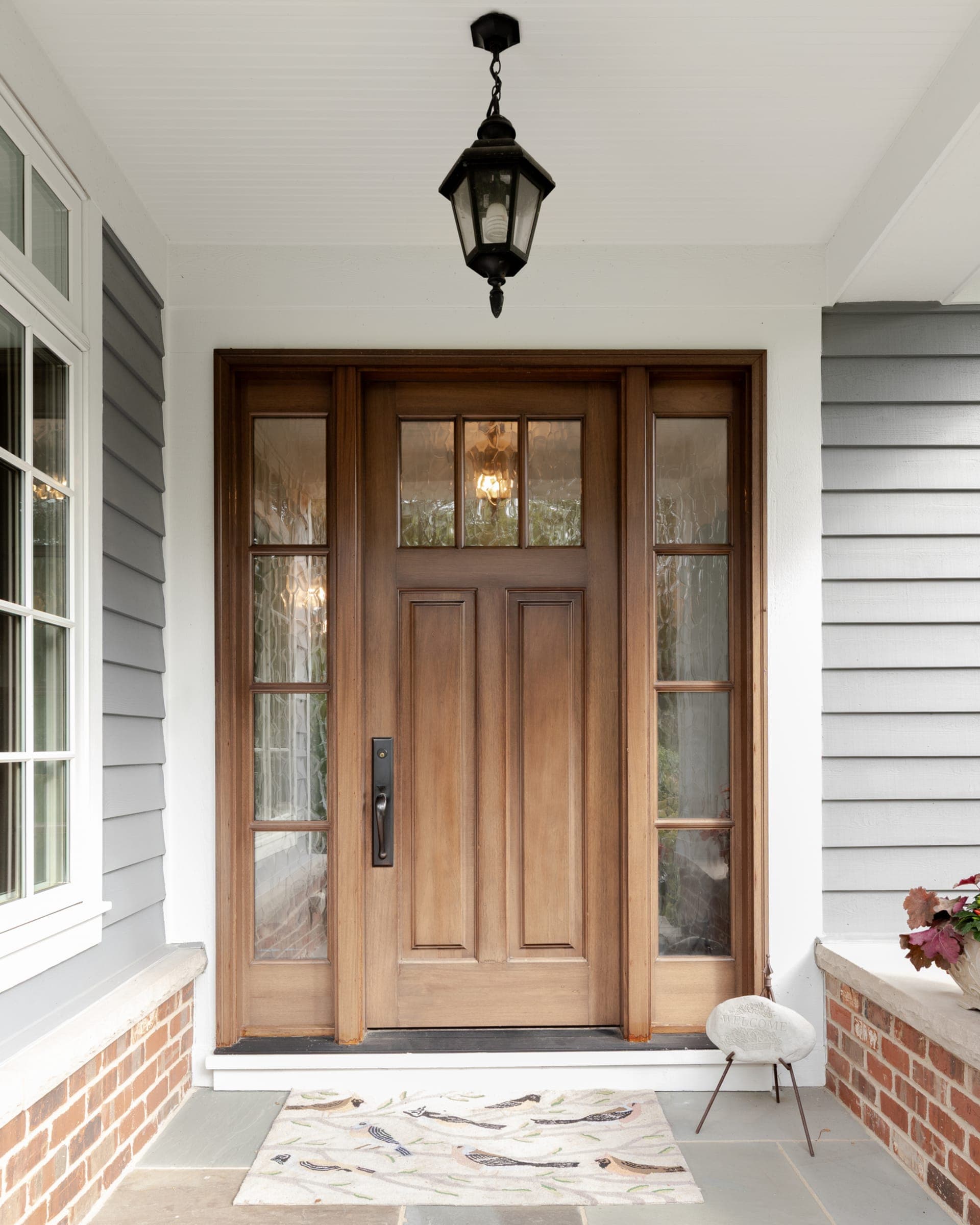 Premium wood entry door with sidelights installed by NexVue Exteriors in Denver